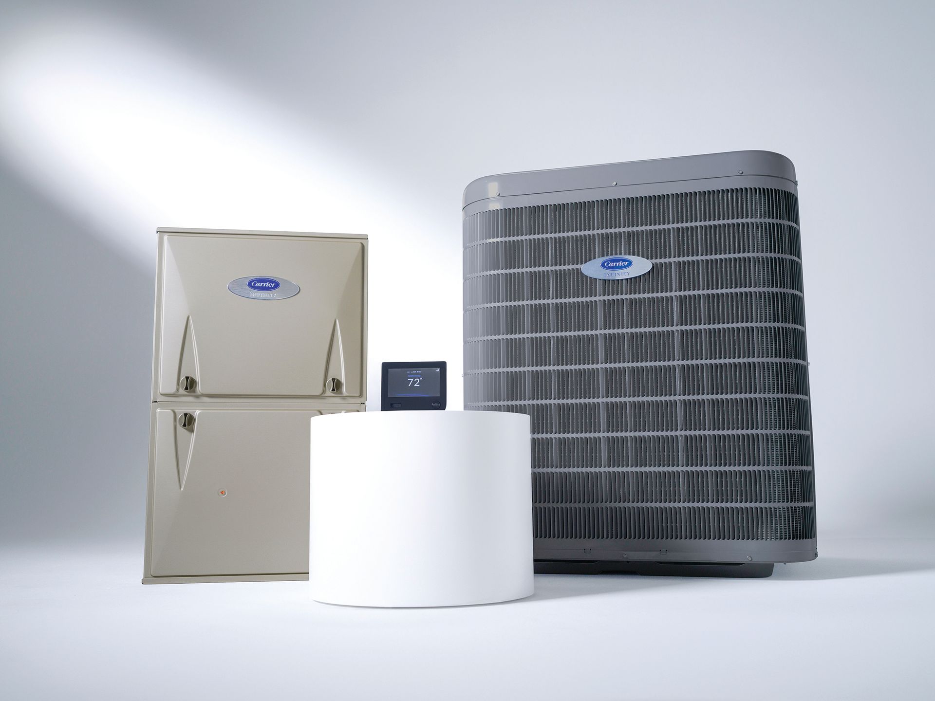 A carrier air conditioner is sitting next to a refrigerator