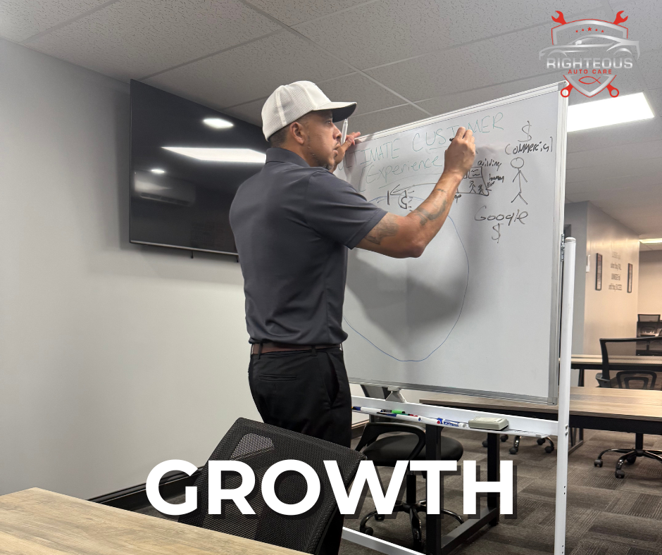 Man in a cap writing on a whiteboard | Righteous Auto Care
