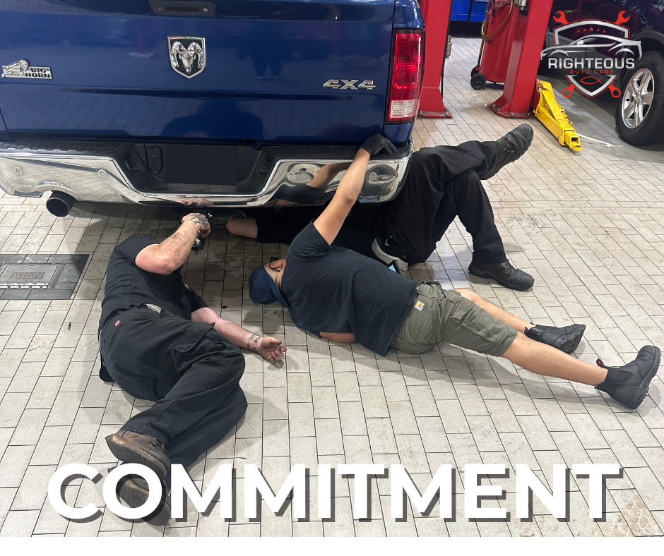 Three mechanics working under a blue pickup truck | Righteous Auto Care