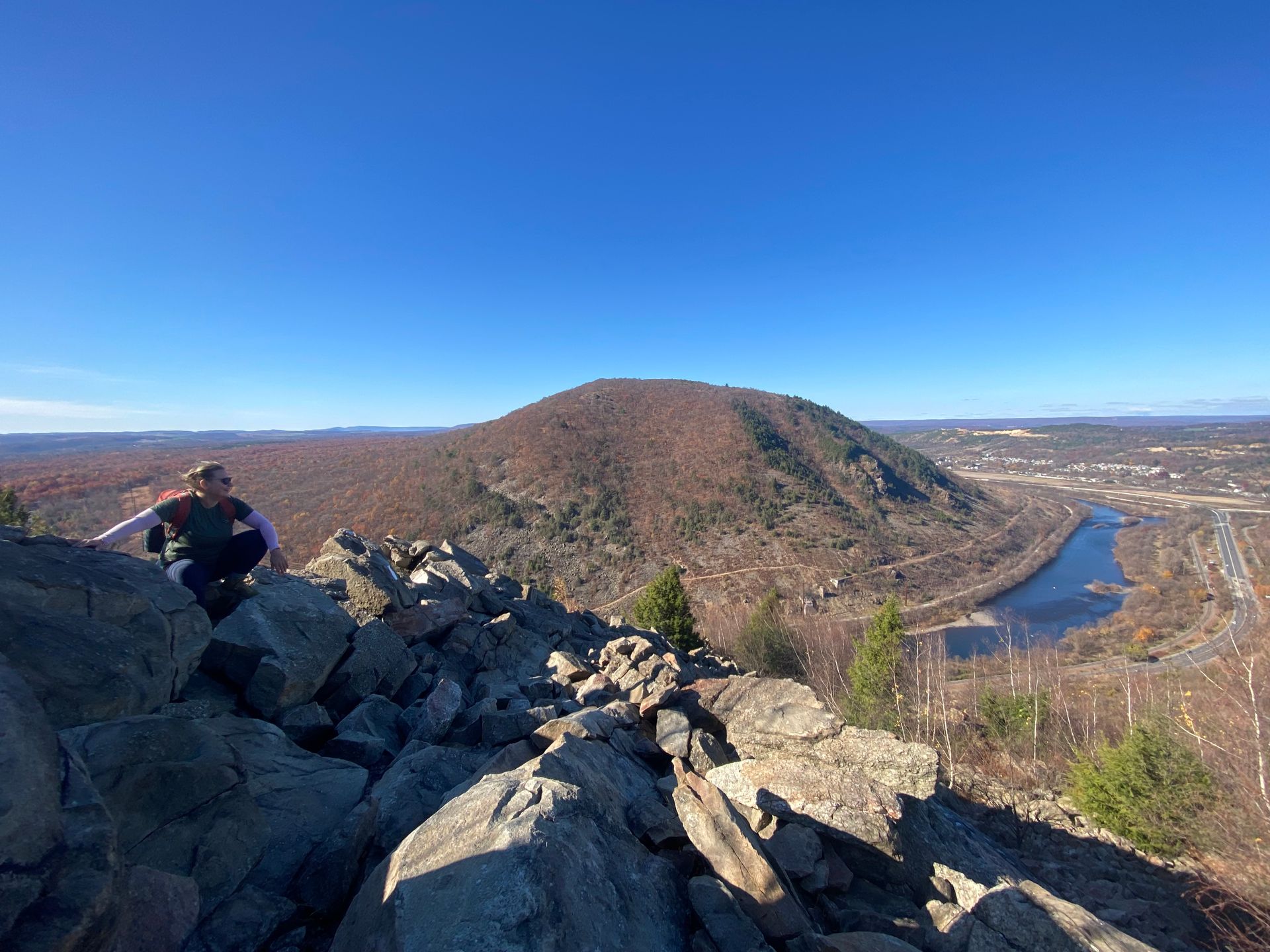 Program Coordinator, Corey S. on a rocky summit.