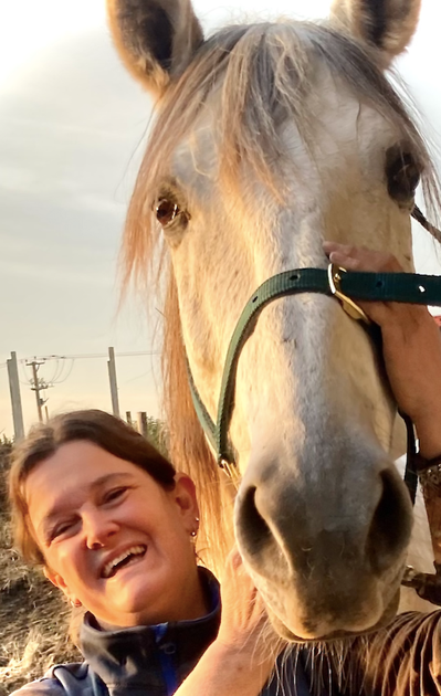 Equine massage therapist, Sarah Wood, with a happy horse after a massage treatment in Lincolnshire