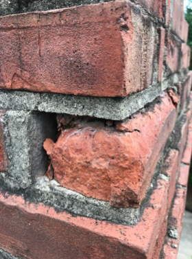 Busted Brick In A Chimney