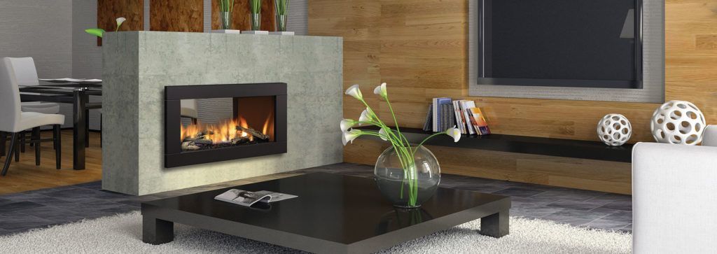A see through fireplace in a living room area.