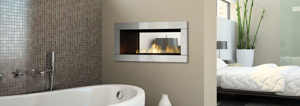 A see through fireplace in a bathroom area.