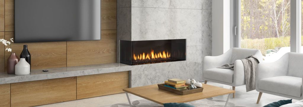 A corner fireplace in a living room area.