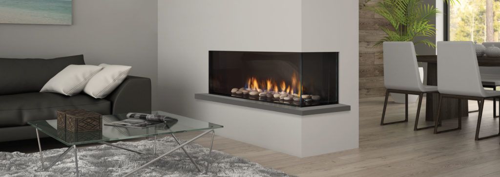 A corner fireplace in a living room area inside a wall feature helps separate this modern room.