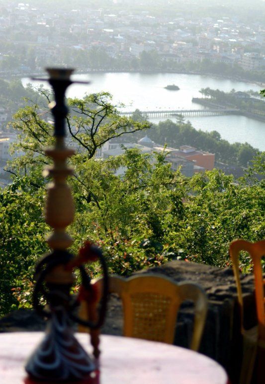 Narghilé (Hookah, Sheesha in Arabic, or Ghelyan in Farsi language) is always present on café tables