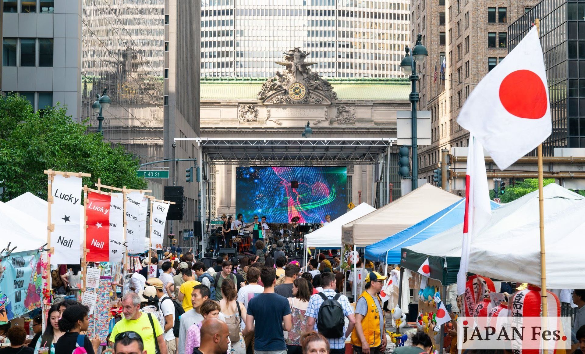 A crowd of people are gathered at a japan festival