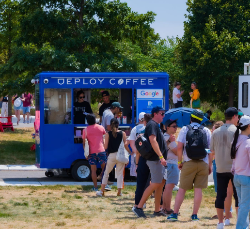a group of people standing outside of Deploy Coffee Truck