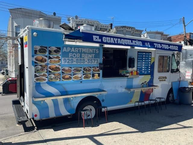 A food truck with apartments for rent on the side of it