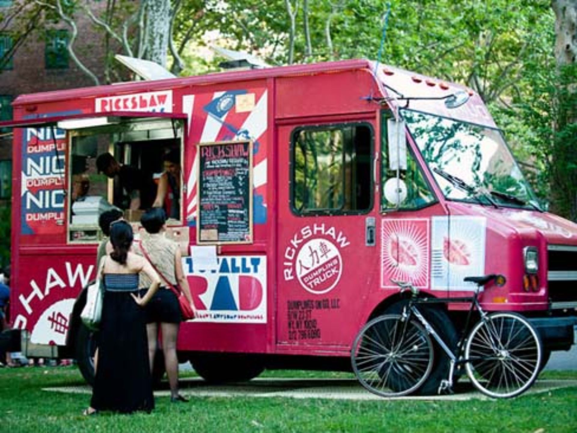 A red food truck that says rickshaw on it