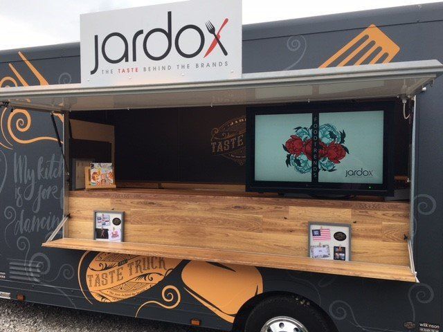 A food truck with a prominent 'Jardox' sign, serving delicious meals on wheels.