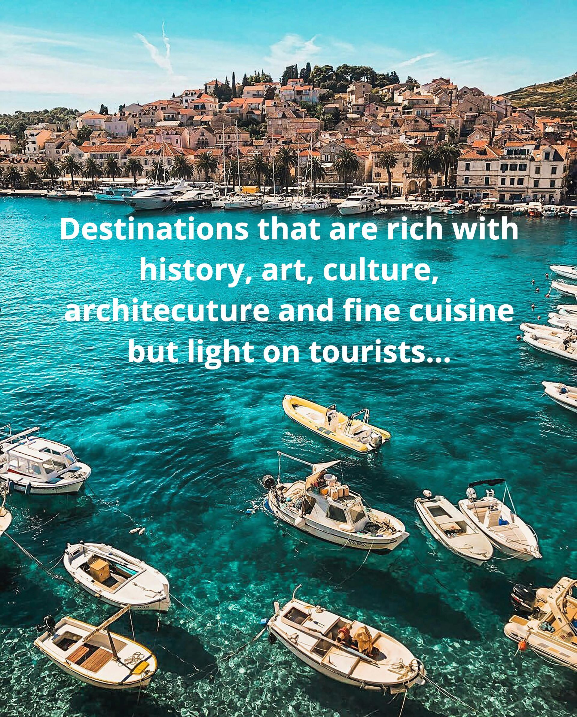 A group of boats are floating on top of a body of water.