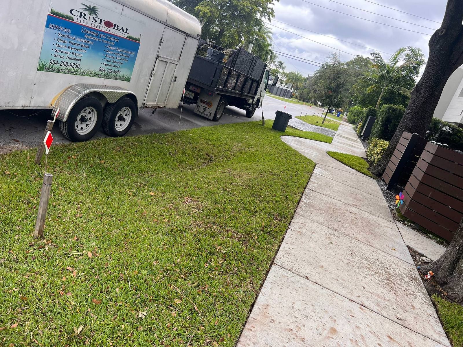 landscape professionals working on lawn