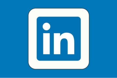 A blue and white linkedin logo on a blue background