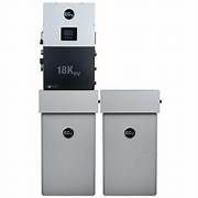 A man is holding a tablet and working on a security system.