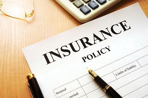 Pen Over the Insurance Policy Form — Miami, FL — American Quality Assurance Group