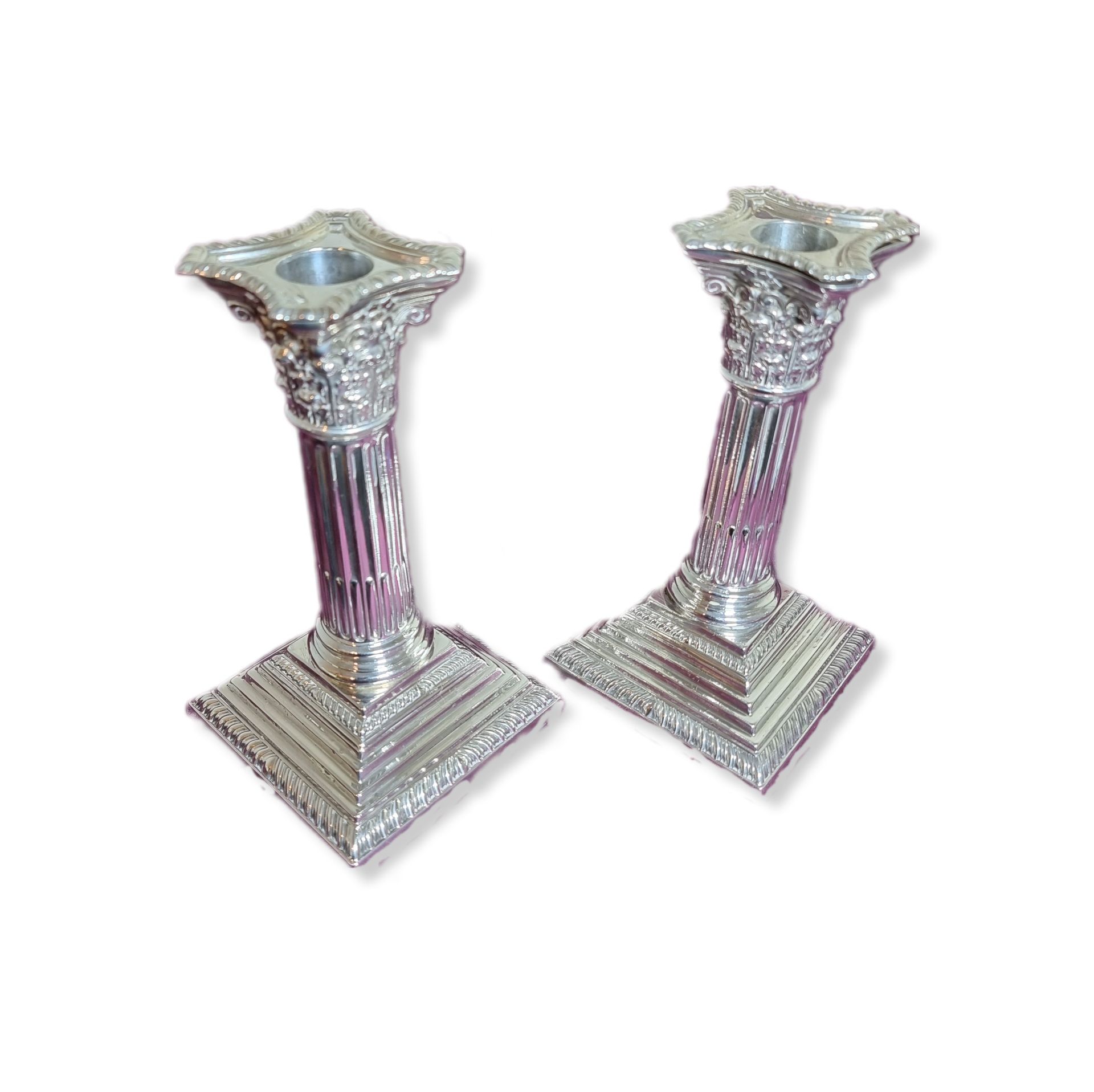 We are pleased to offer this fabulous pair of hallmarked silver corinthian column candlesticks for sale. These candle holders are fully hallmarked for Sheffield 1907 and were crafted by the silversmiths & antique dealers James Jay & Richard Attenborough. James Jay was active from 1867 at 366 Essex Road, London. In 1887, he purchased stock and premises of Richard Attenborough at 142 - 144 Oxford Street. In 1897, the firm became James Jay Ltd and in 1904 Jay, Richard Attenborough & Co Ltd. The business closed after 1950. These sticks are in very good used condition with slight signs of use and age. 1086g (gross weight) 17cm H x 9cm W (Base) x 9cm D (Base)