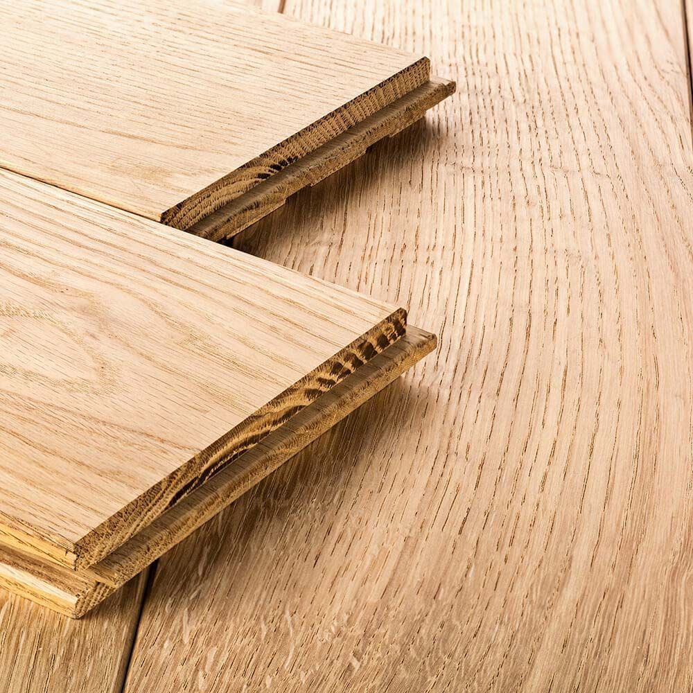 Two pieces of wood are stacked on top of each other on a wooden table.