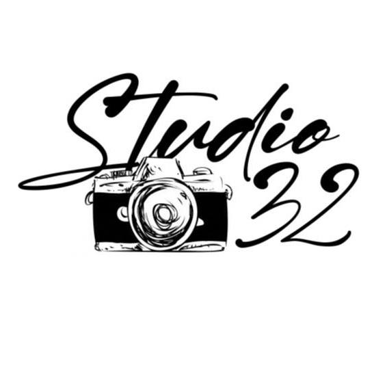 A black and white logo for studio 32 with a camera