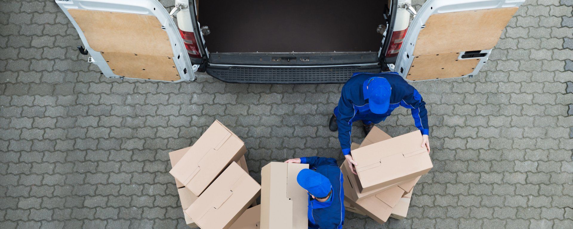 Loading storage boxes onto a van.