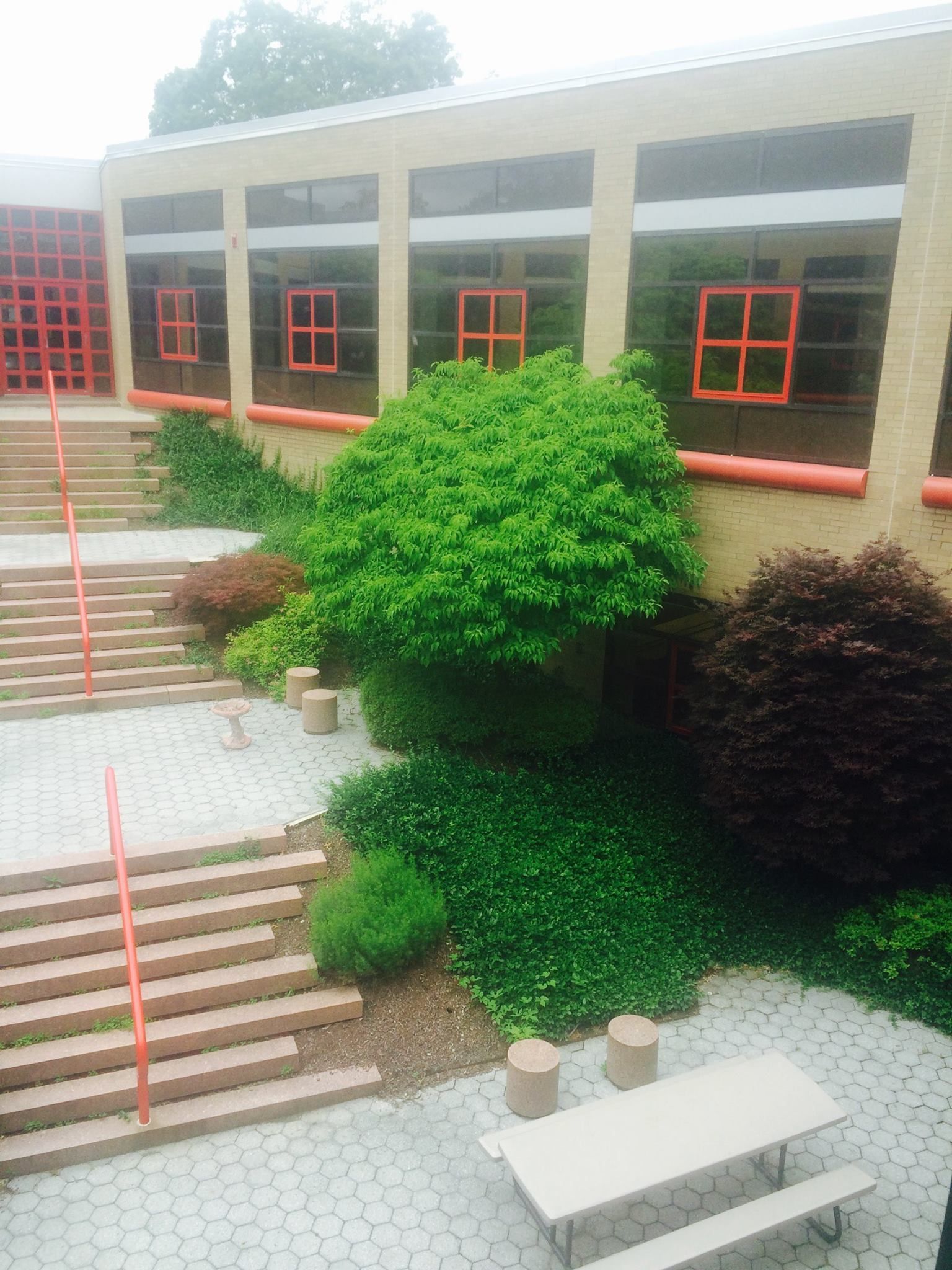 A Building with Stairs and A Picnic Table in Front of It - Tunkhannock, PA - Superior Landscape Management