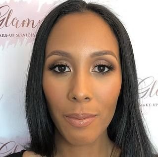 A close up of a woman 's face with makeup on