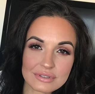 A close up of a woman 's face with makeup on
