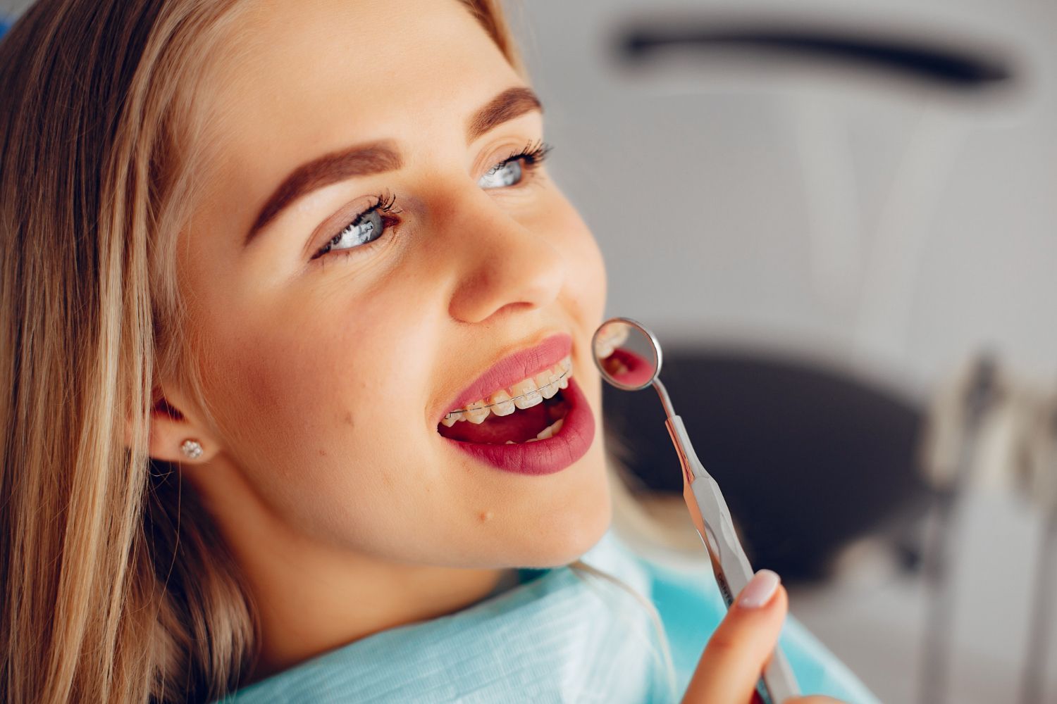 woman smiling at dentist | gum disease therapy in Morgantown WV