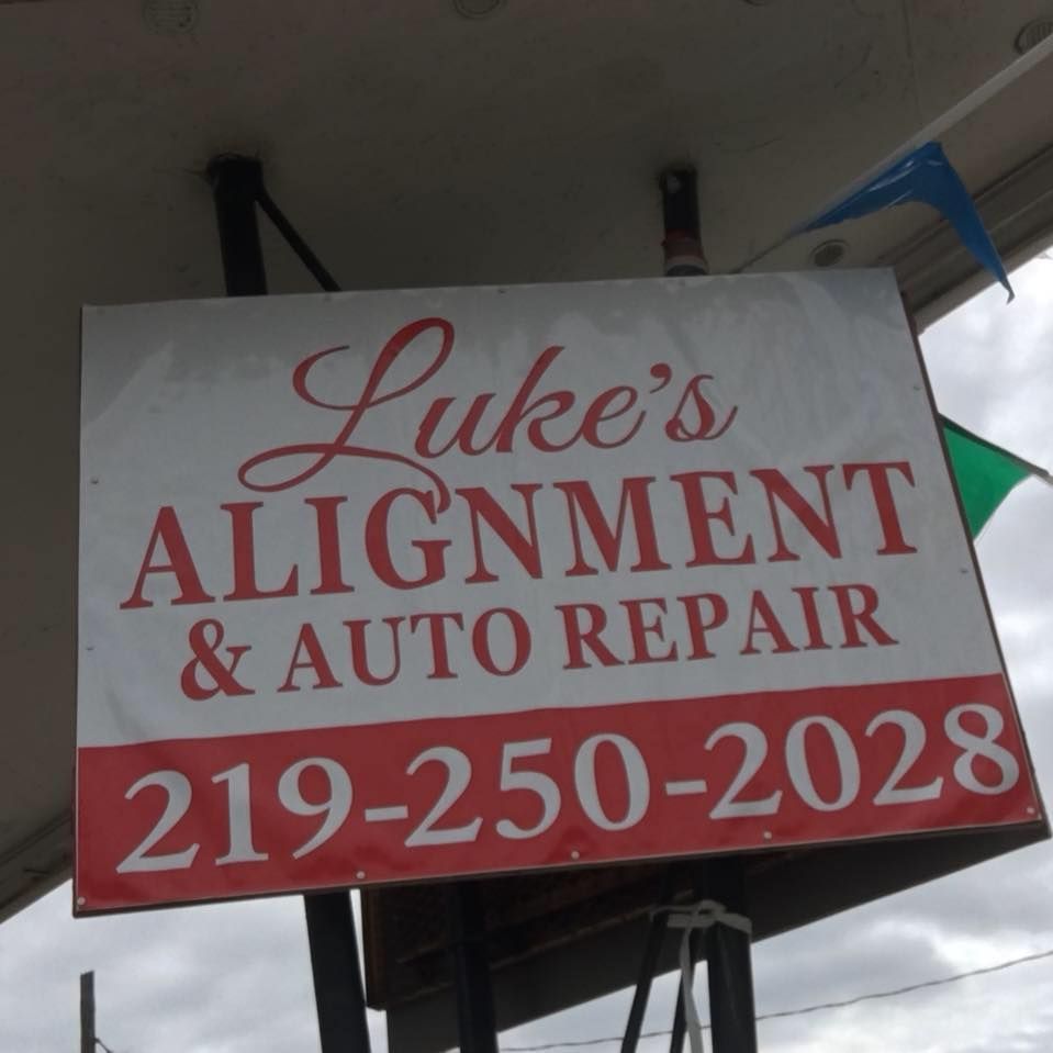 A sign for luke 's alignment and auto repair