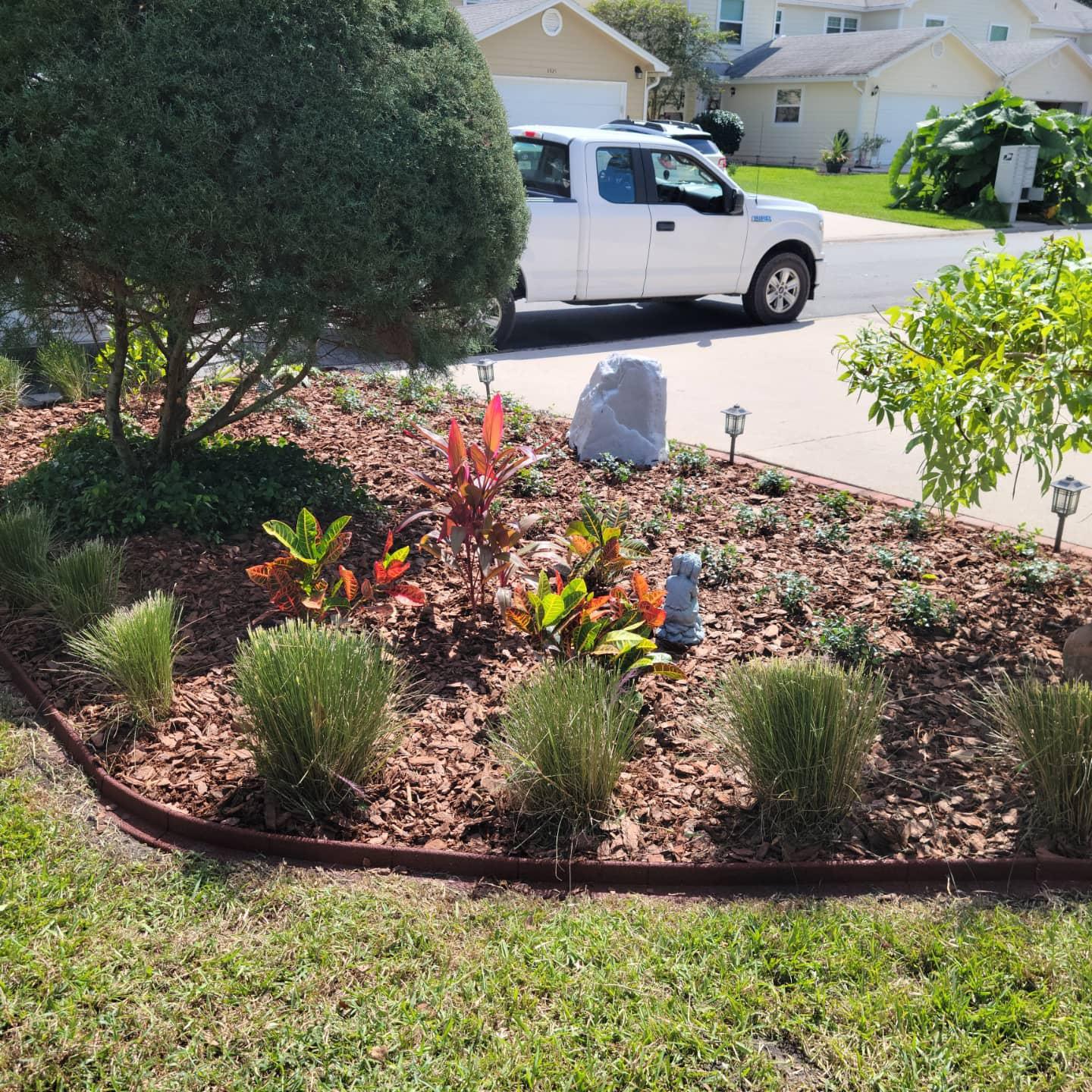 A white truck is parked in the driveway of a house