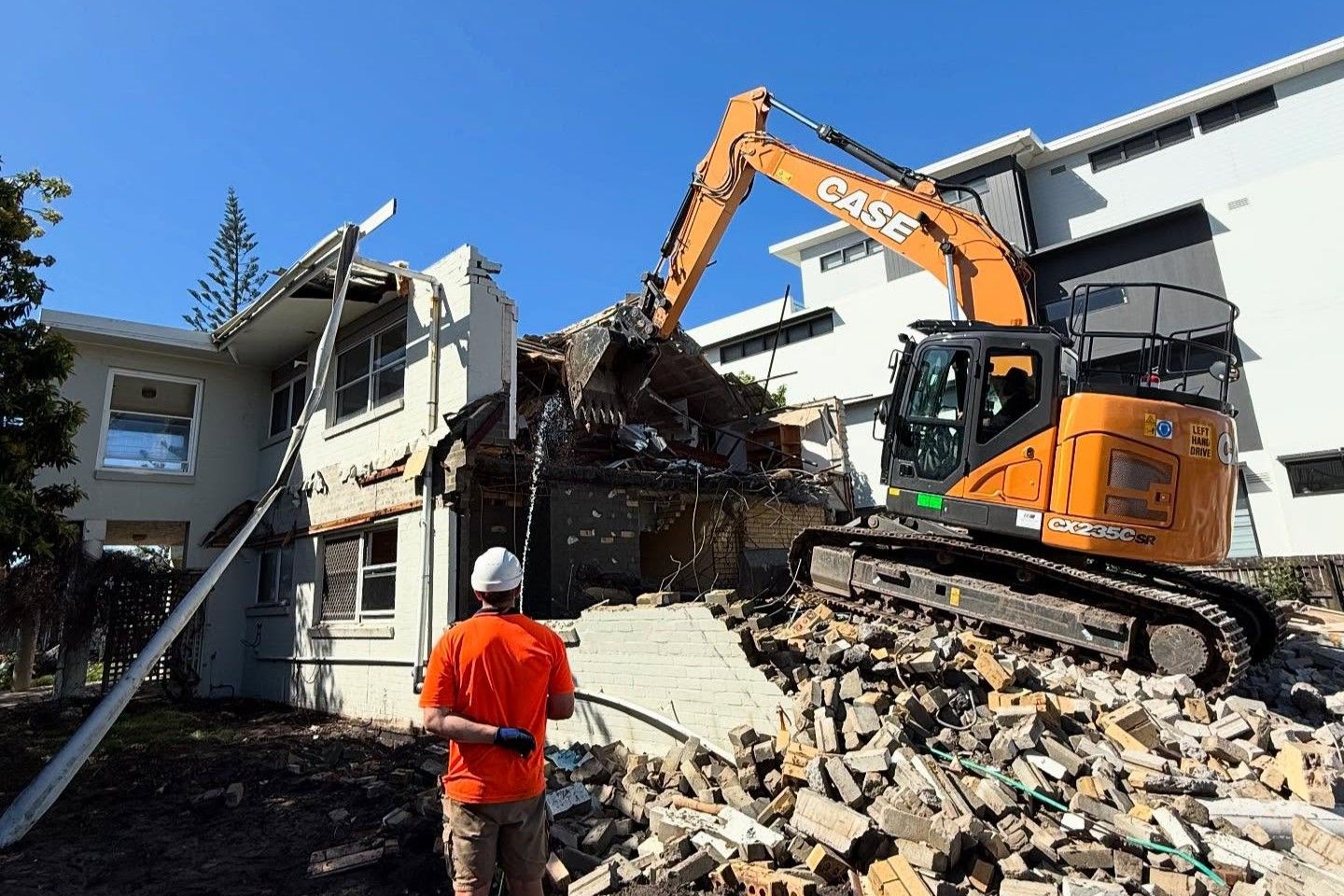 Demolition Of A Building Using Excavator