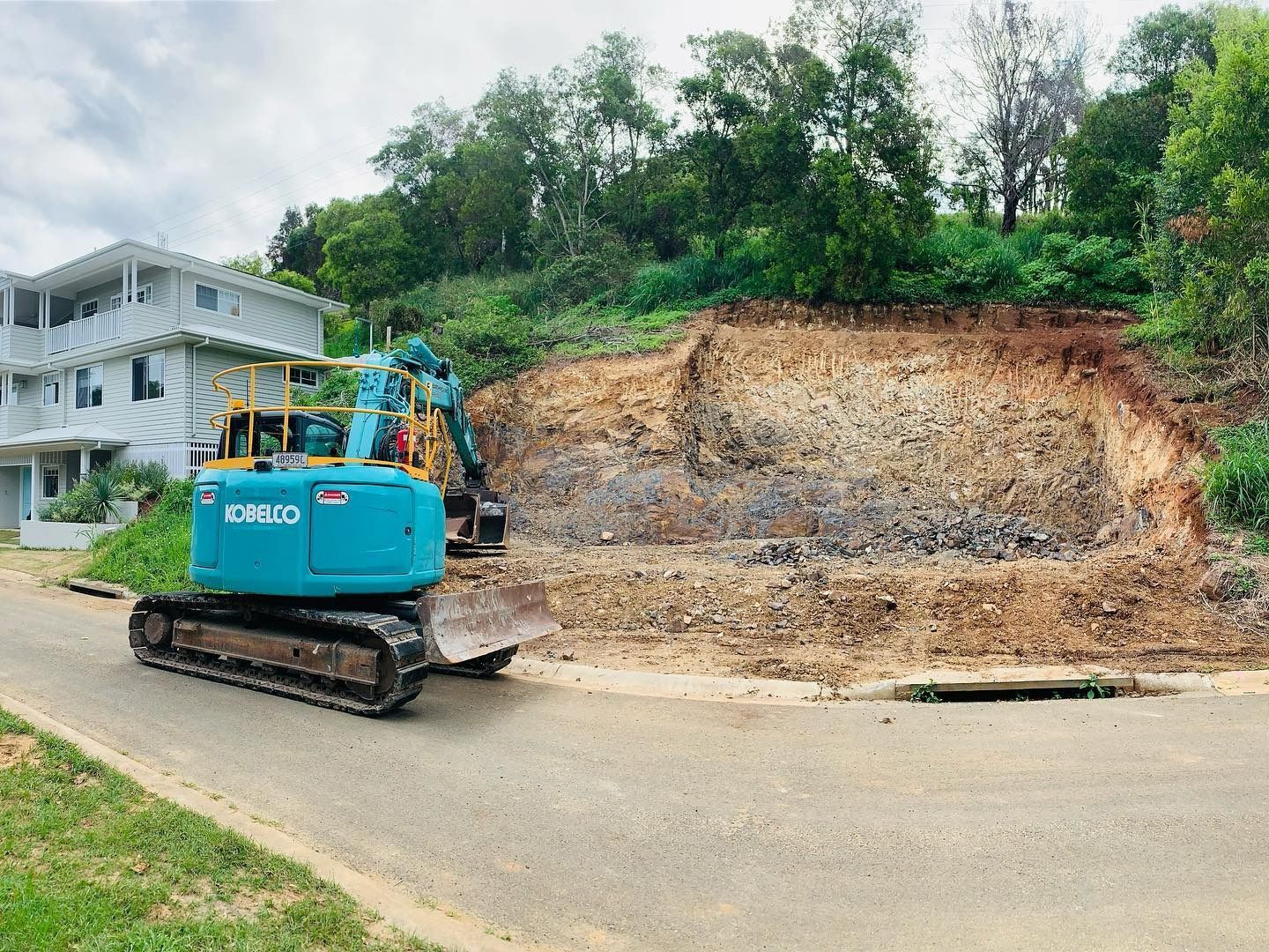 Excavator Sits on a Road for Industrial Demolition