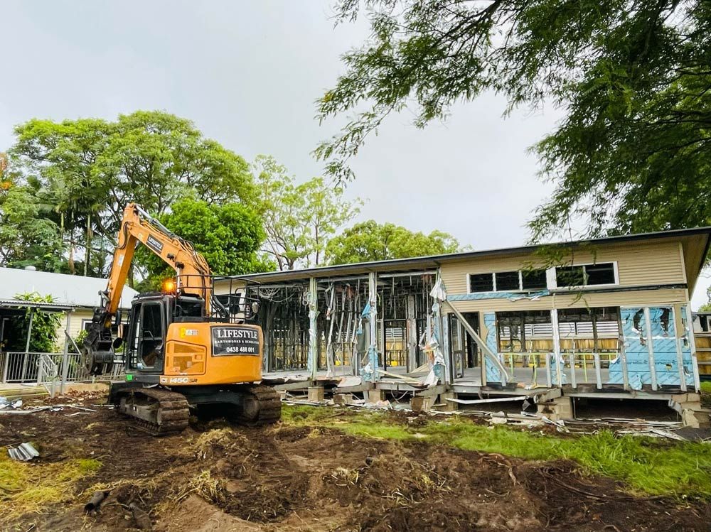 A Demolisher Is Destroying a House — Lifestyle Demolition In Lismore, NSW