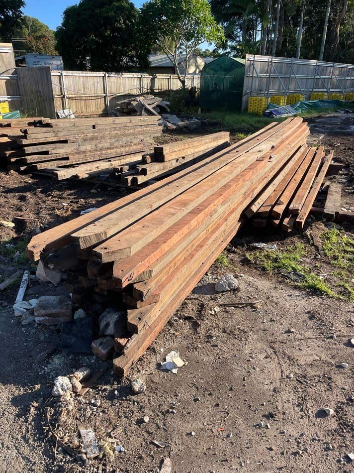 A Bulldozer Is Demolishing a Brick Building — Lifestyle Demolition In Byron Bay, NSW