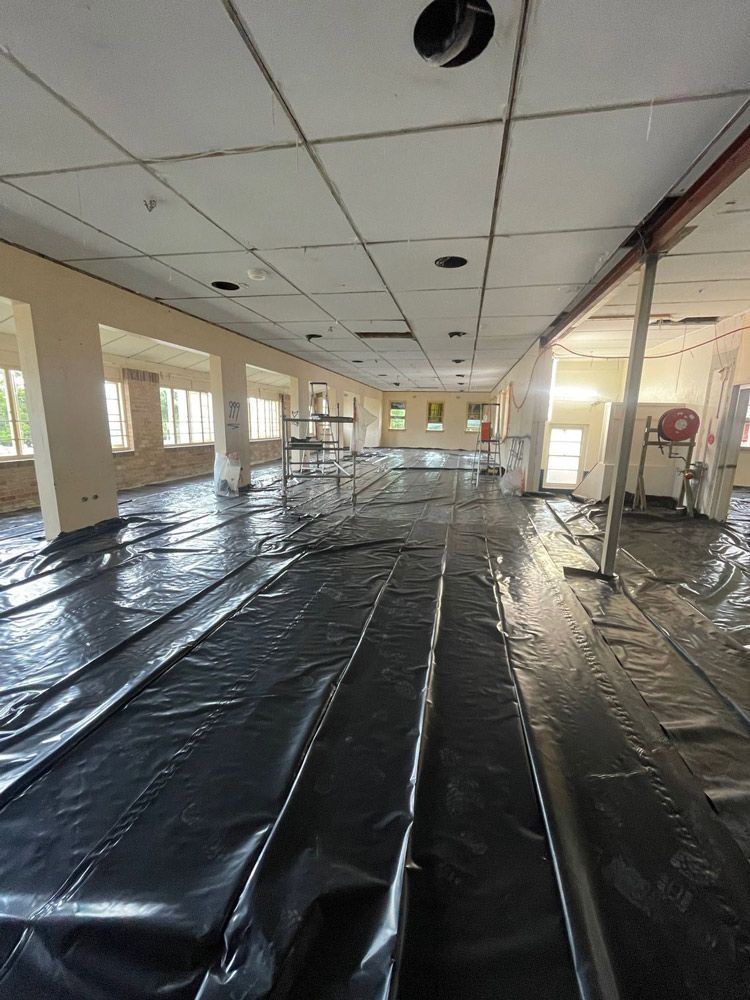 A Large Room with A Lot of Black Plastic on The Floor — Lifestyle Demolition in Kingscliff, NSW