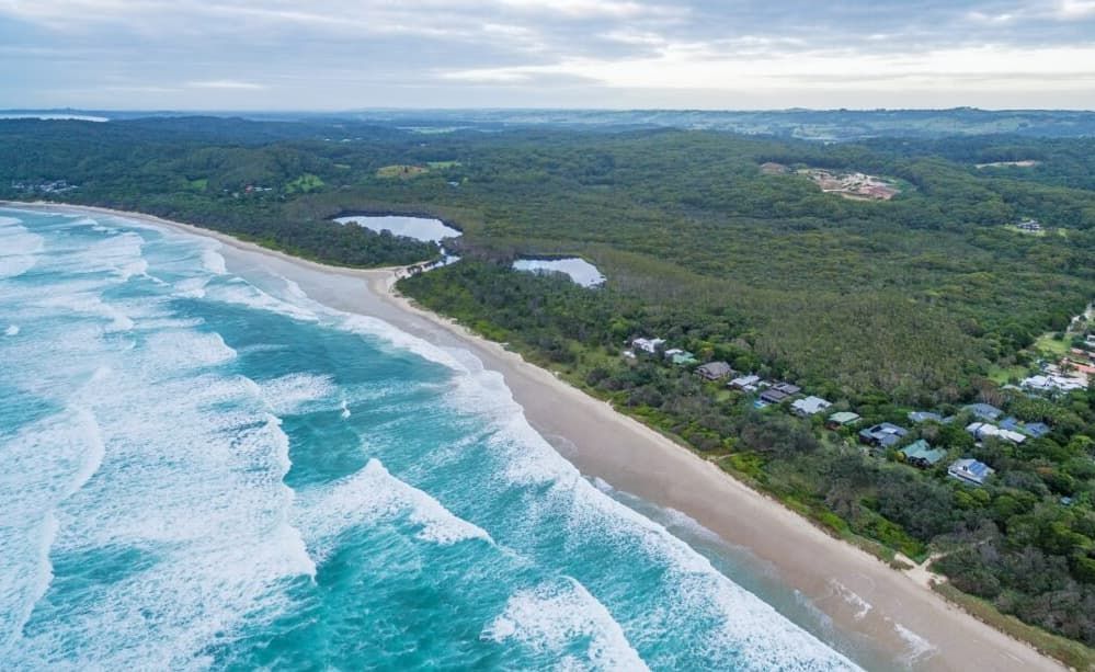 Aerial View Of A Beach With Foamy Waves Crashing On The Shore — Lifestyle Contaminated Soil In Ballina, NSW
