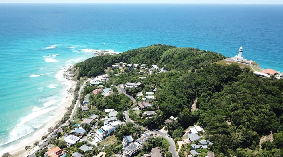 Aerial View Of A Coastal Town With Houses, Roads, And Lush Greener — Lifestyle Demolition In Byron Bay, NSW