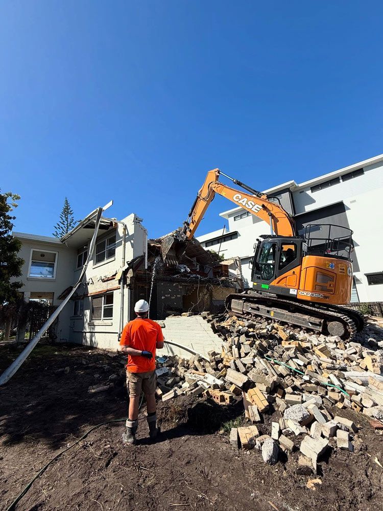 Man Standing Next to A Demolished House — Lifestyle Demolition In Tweed Heads, NSW