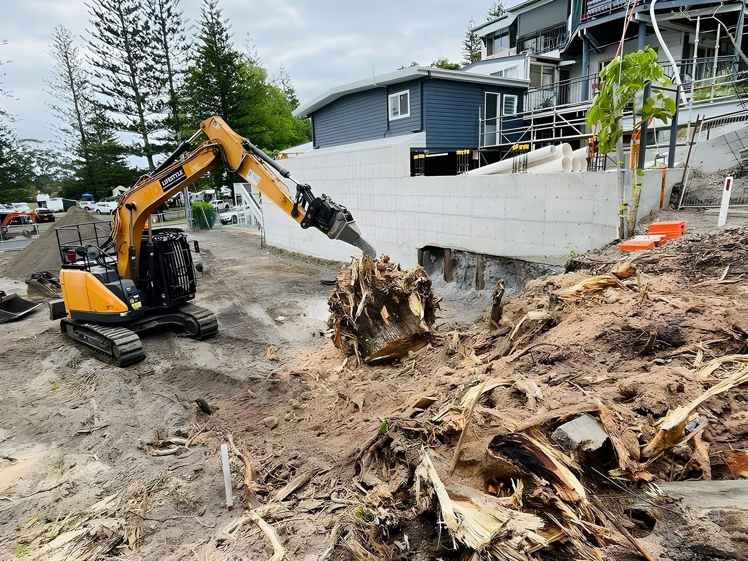 Yellow Excavator Performing Demolition