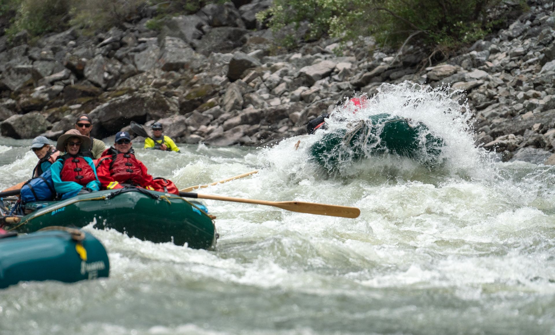 A group of people are rafting down a river.