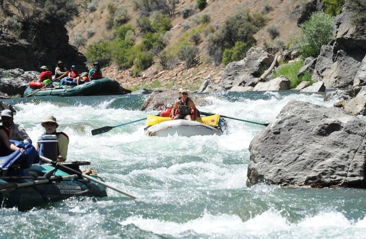 A group of people are rafting down a river.