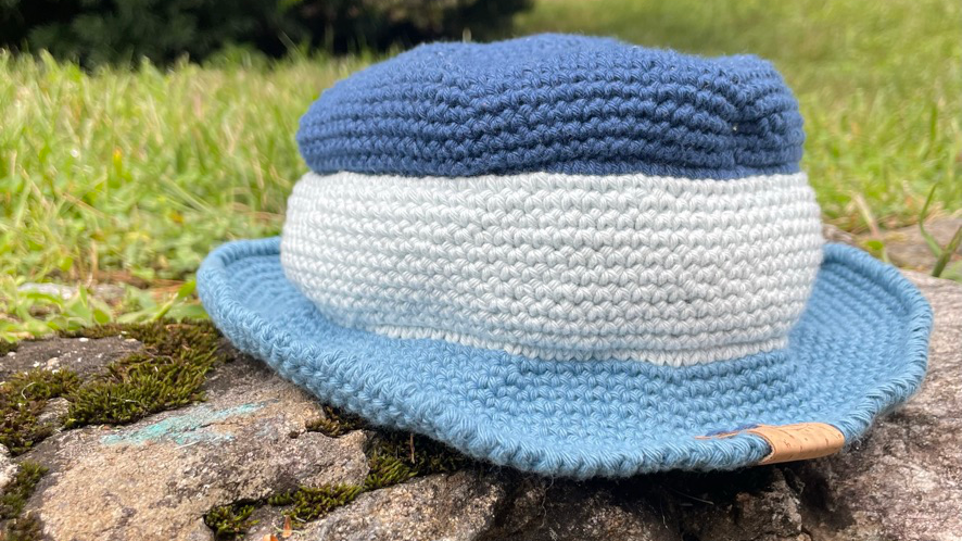Child's bucket hat in three different shades of blue. 