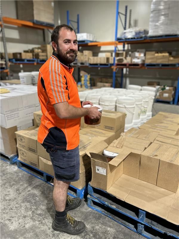 A Wooden Table Topped With Spaghetti and Vegetables — Corrado & Frank Distributors in Fairy Meadow, NSW