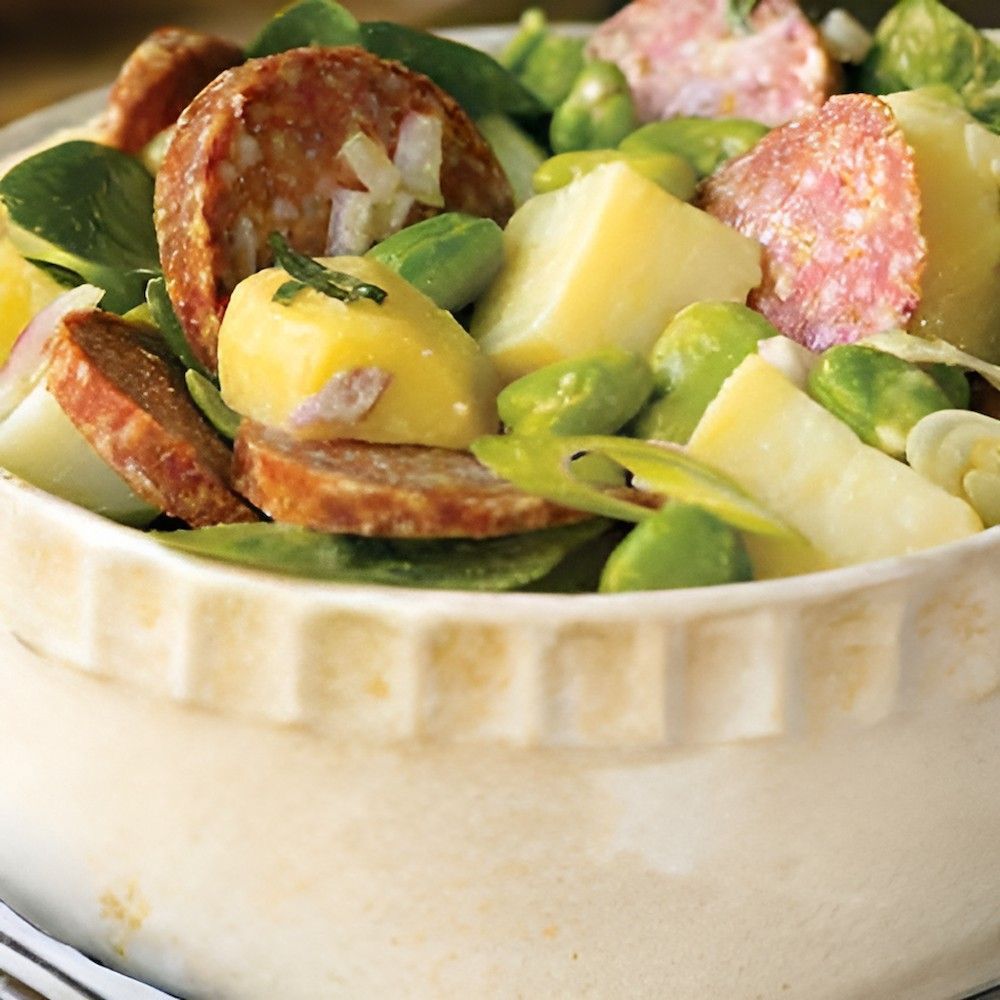 A White Bowl Filled With Vegetables and Sausage on a Table — Corrado & Frank Distributors in Fairy Meadow, NSW