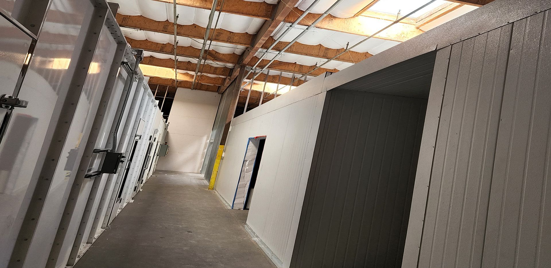 a hallway in an industrial park showing new facings on the walls