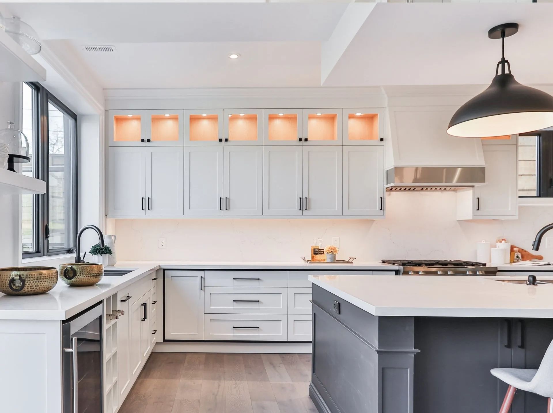 A modern kitchen with cabinets and lighting demonstrating what new drywall can do.