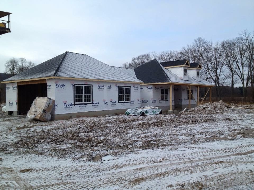 A house that is being built in the snow