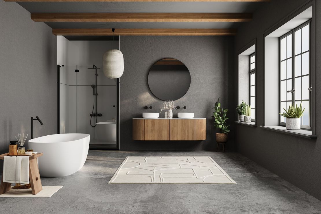 A bathroom with a bathtub , sinks , mirror and window.
