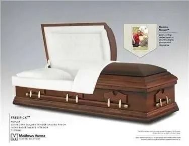 Open wooden casket with white interior, silver hardware, and a framed photo.